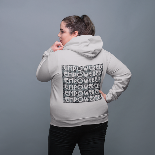 Woman wearing empowered hoodie showing back