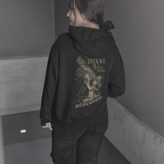 woman wearing Embrace All That You Discover black pullover hoodie back view